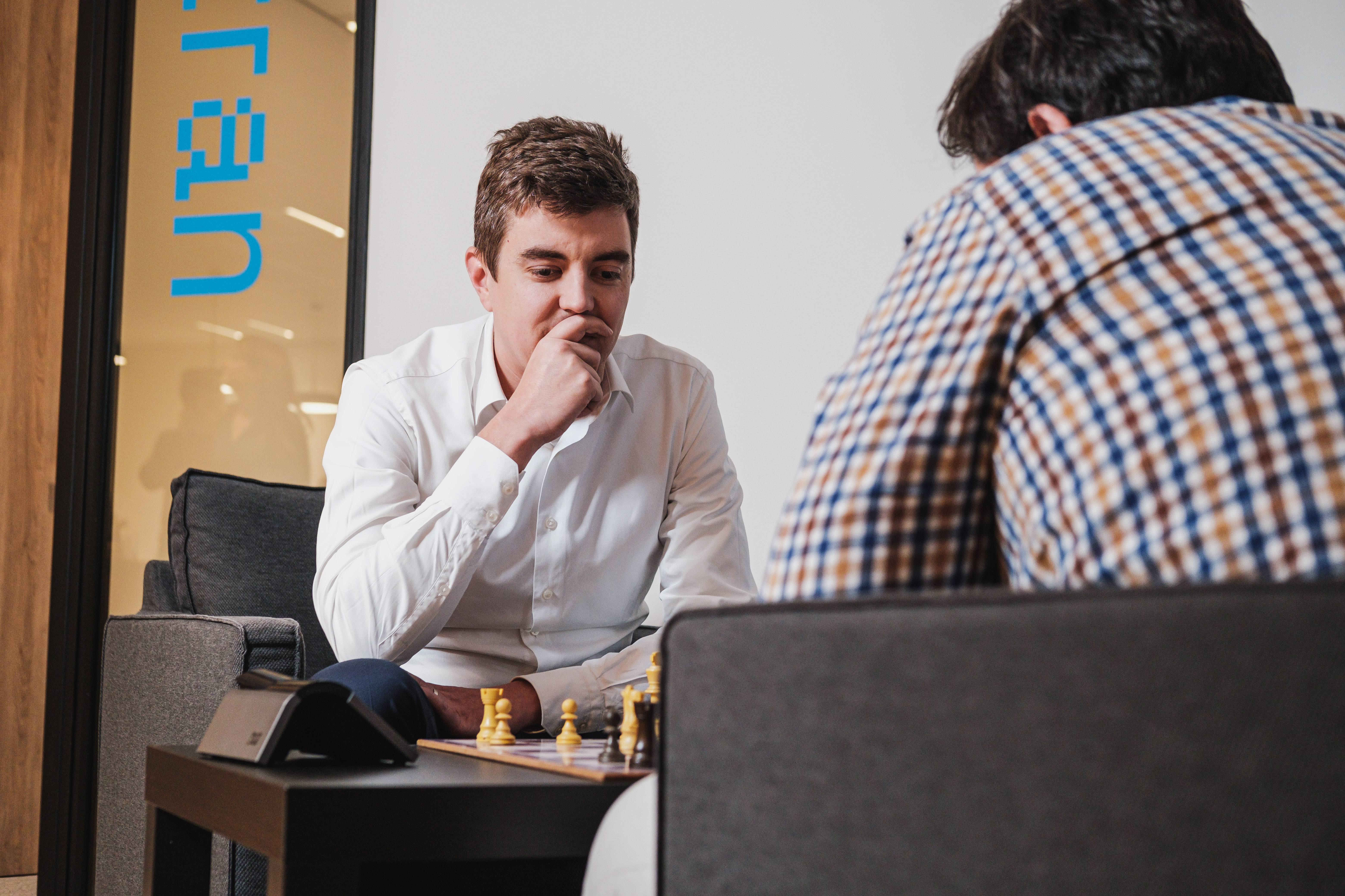 Playing chess in the office to unwind.