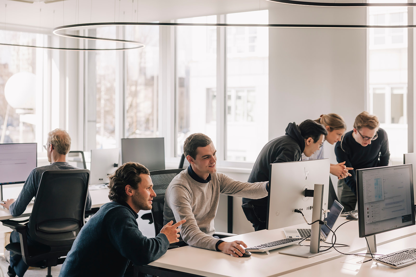 Colleagues working together from our office in Antwerp.