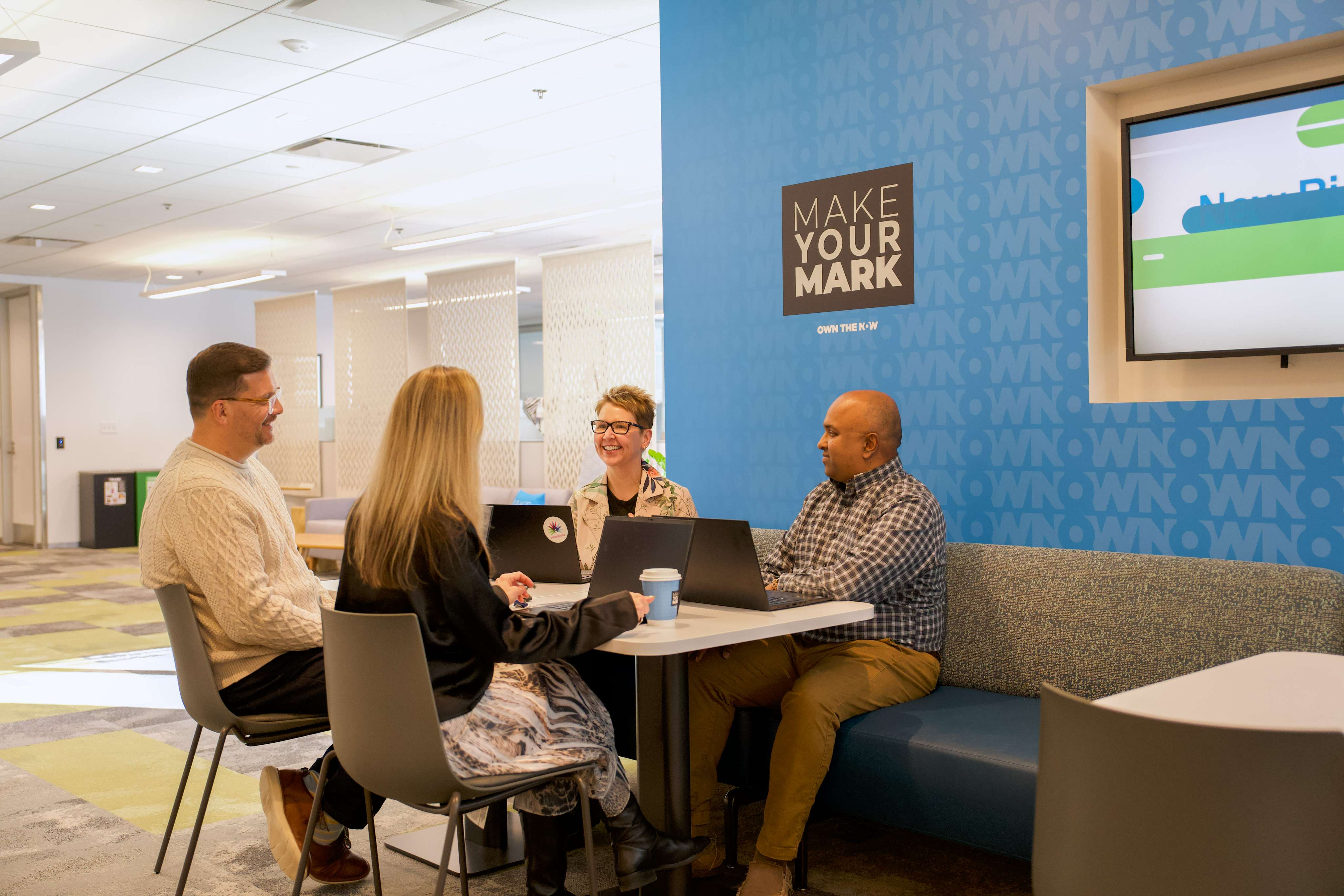 Employees having a casual team meeting