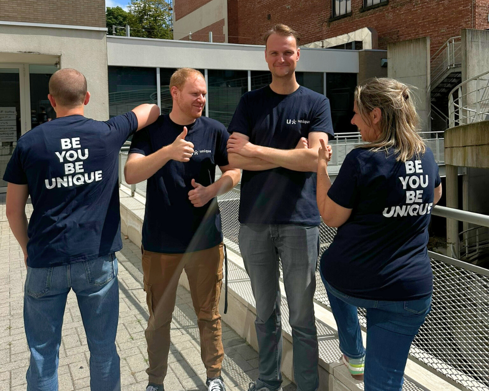 Employees wearing Unique t-shirts